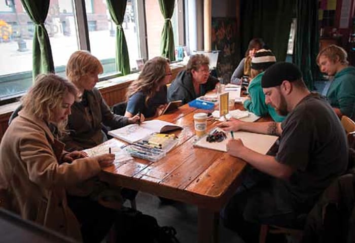 Artists’ drawing circle in the Black Dog Coffee and Wine Bar. Almost all of the artists pictured contributed artwork to this Almanac.