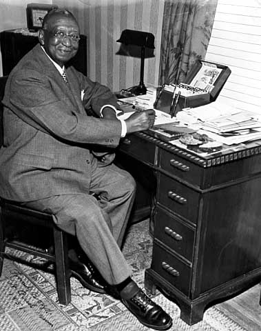 Frank Boyd in his home on Mackubin Avenue, St. Paul, 1951; Secretary Treasurer of the B.S.C.P. (Brotherhood of Sleeping Car Porters).